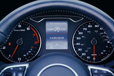 Close-up of a speedometer displaying the vehicle's current speed in kilometers per hour.